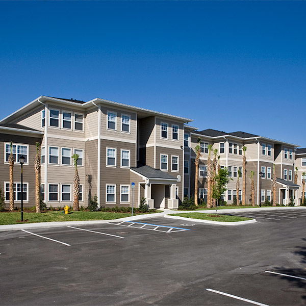 A landscape view of the exterior of a new apartment complex